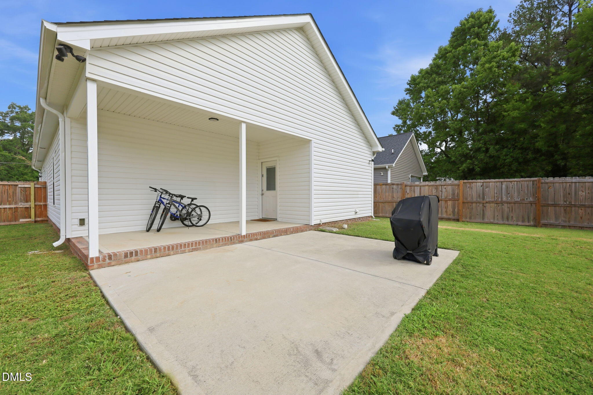 709 South Pollock Street Selma, NC 27576 - Photo 25 of 30 a view of a house with a backyard