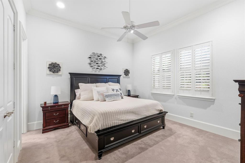 476 Hidden Valley Lane Coppell, TX 75019 - Photo 30 of 40 a bed sitting in a bedroom next to a window