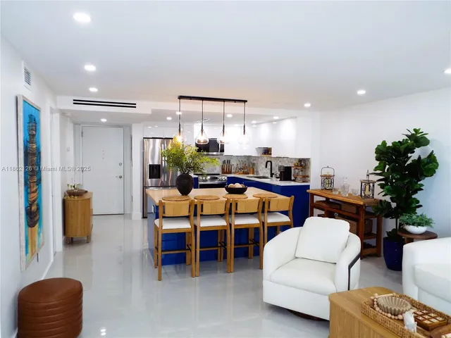 a kitchen with sink and refrigerator