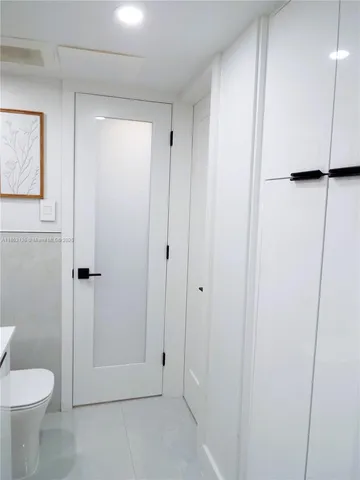 a bathroom with a shower and a toilet