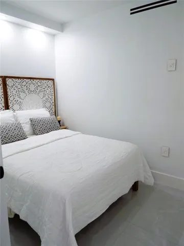 a bathroom with a shower and a sink