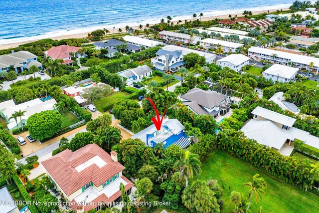 an aerial view of residential houses with outdoor space and street view