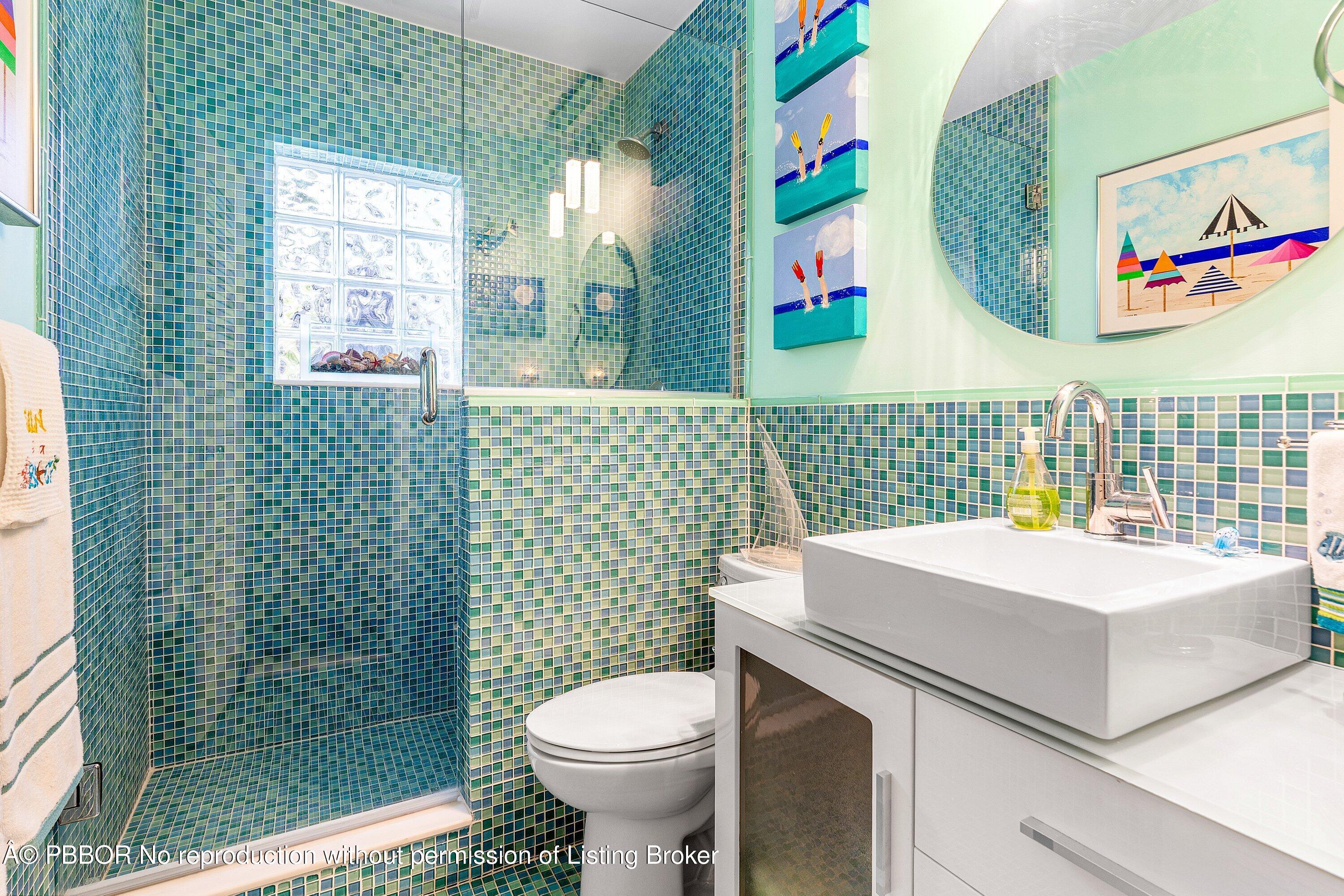 110 Dolphin Road Ocean Ridge, FL 33435 - Photo 17 of 33 a bathroom with a sink a toilet and shower