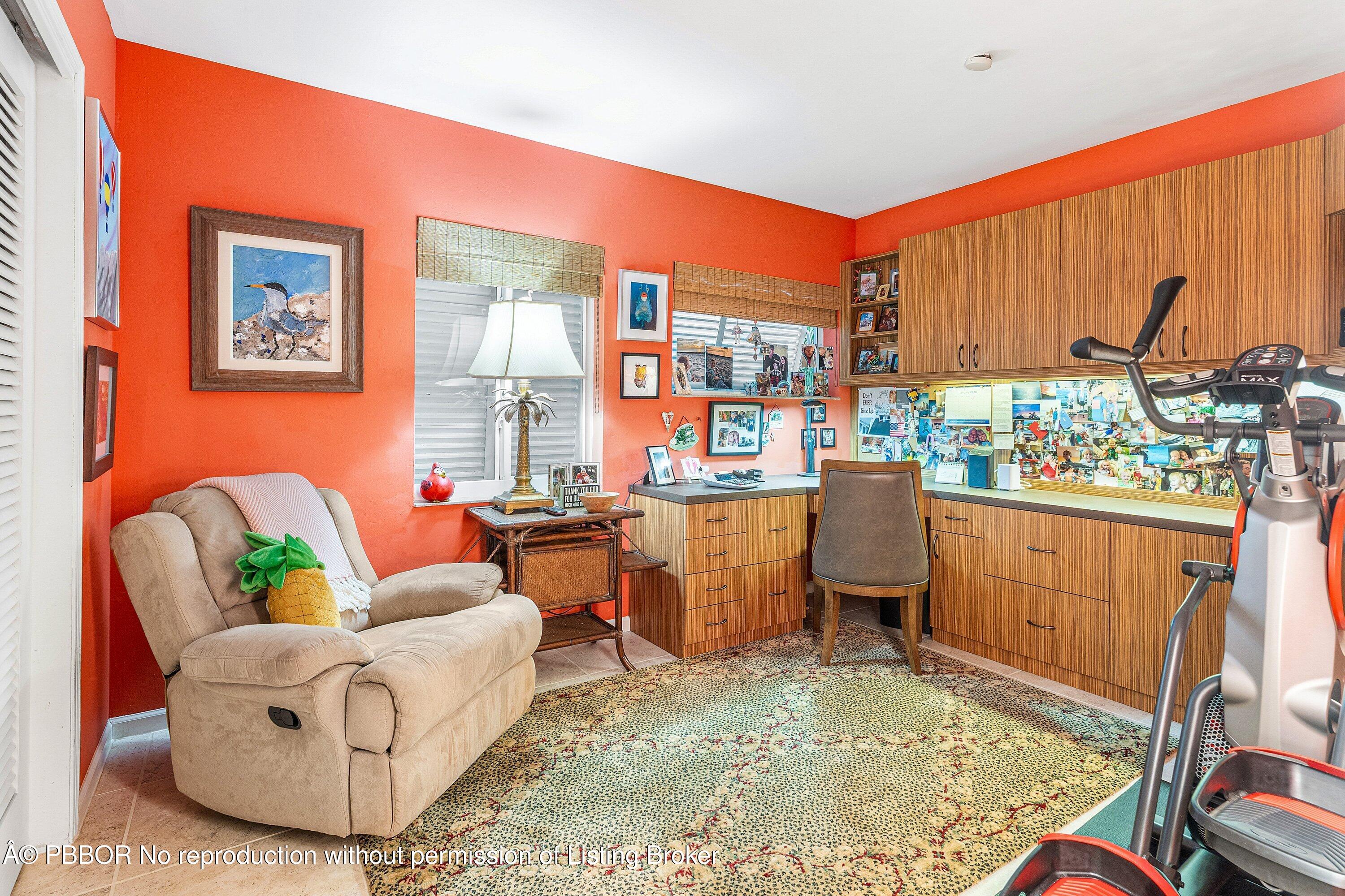 110 Dolphin Road Ocean Ridge, FL 33435 - Photo 18 of 33 a living room with furniture a window and a flat screen tv