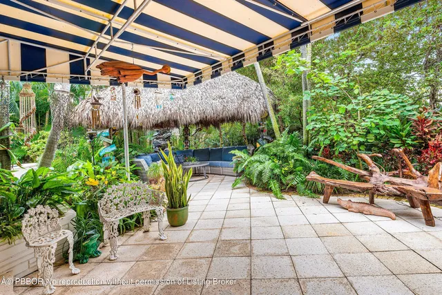 a view of a backyard with sitting area