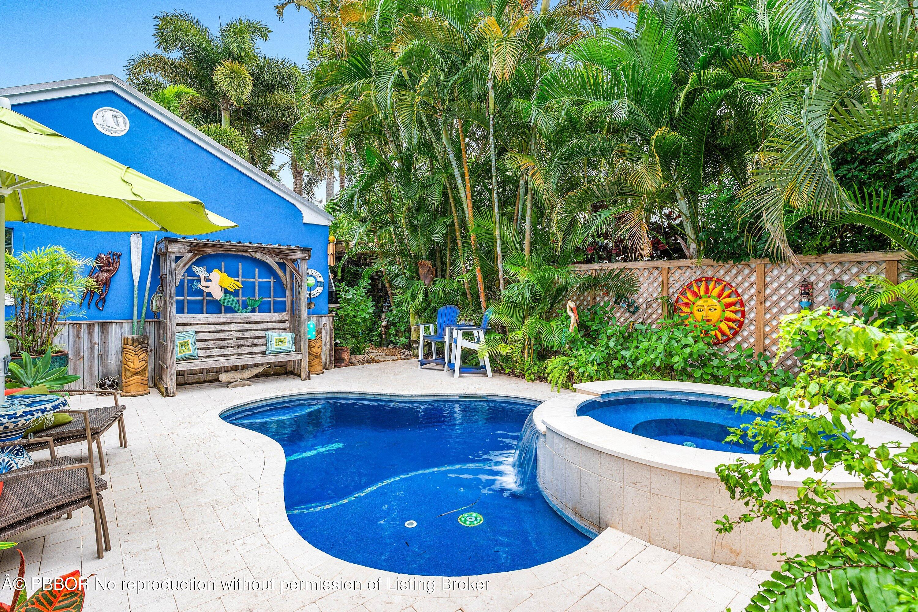 110 Dolphin Road Ocean Ridge, FL 33435 - Photo 24 of 33 a view of a swimming pool with a patio