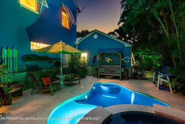 an outdoor space with furniture and umbrella