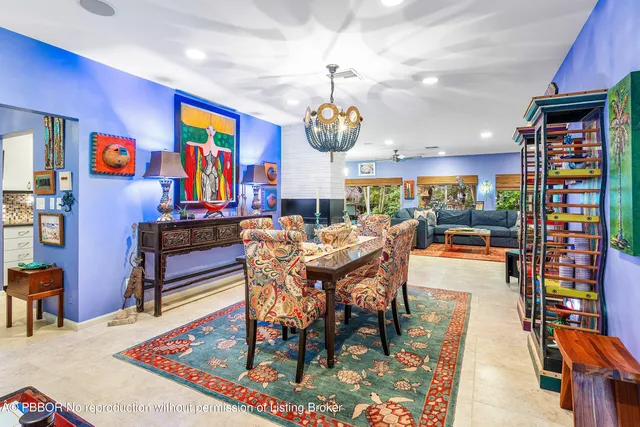 a living room with fireplace furniture and a rug