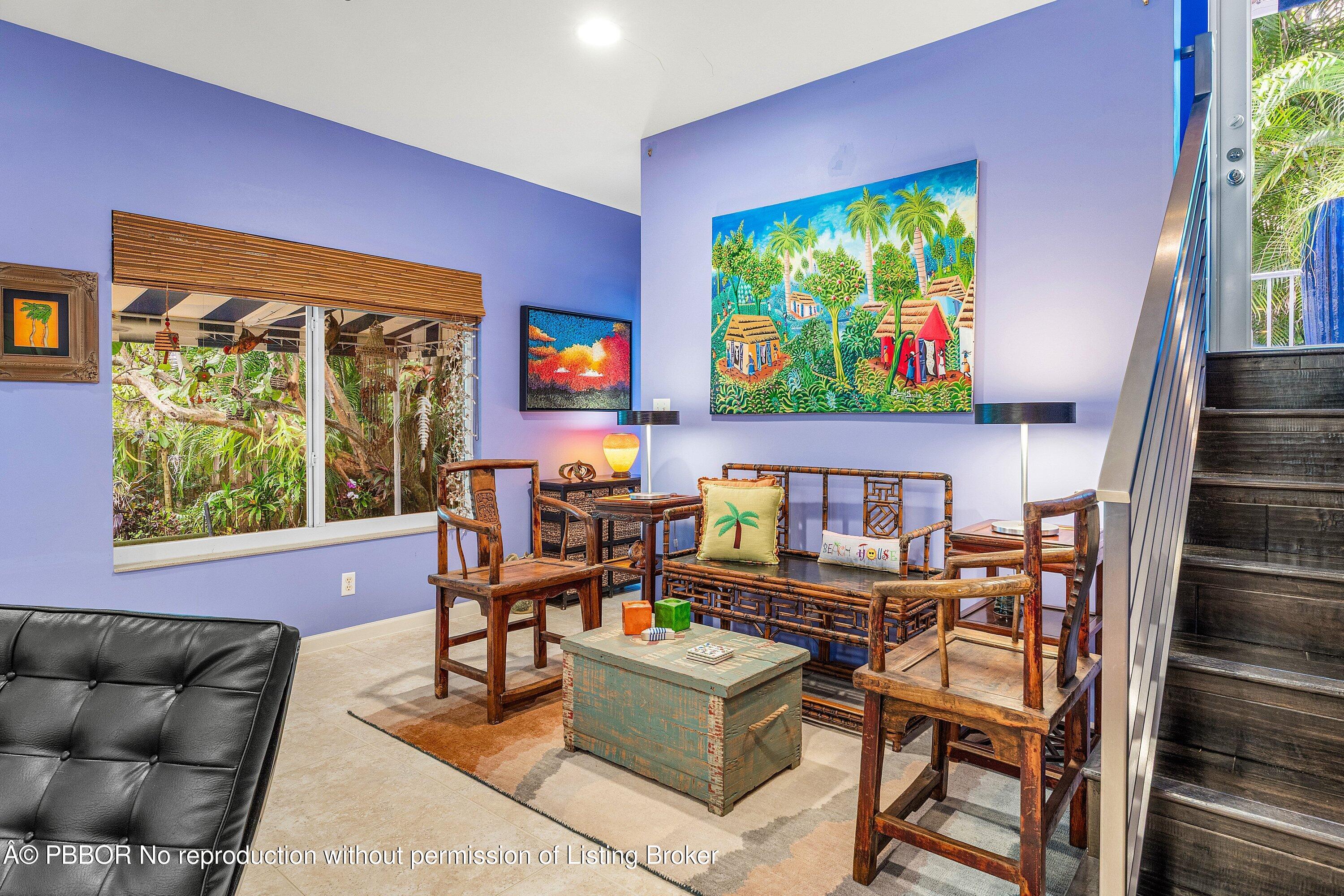 110 Dolphin Road Ocean Ridge, FL 33435 - Photo 9 of 33 a living room with furniture a floor to ceiling window and a flat screen tv