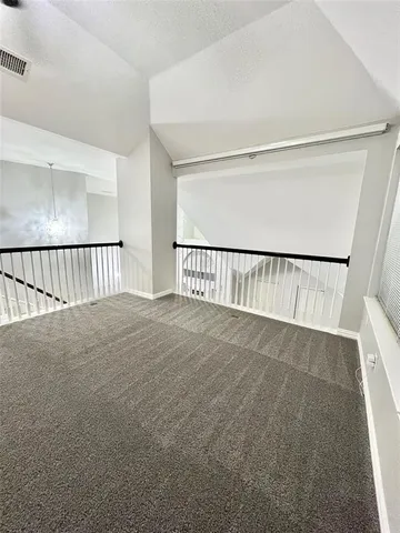 a view of a hallway with a stairs