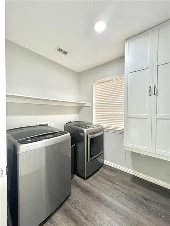 a kitchen with a stove and a microwave