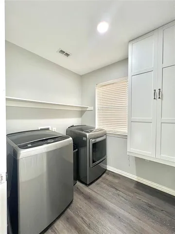 a kitchen with a stove and a microwave