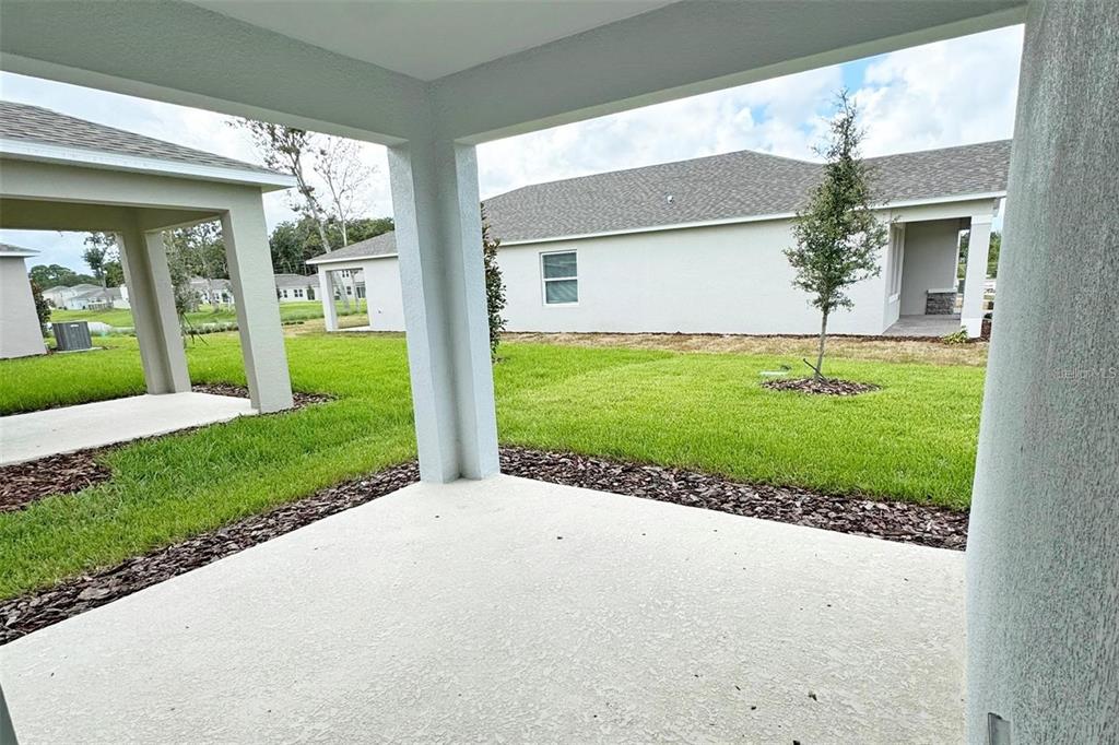 186 Jones Fish Camp Road Edgewater, FL 32141 - Photo 14 of 15 a view of a house with a garden