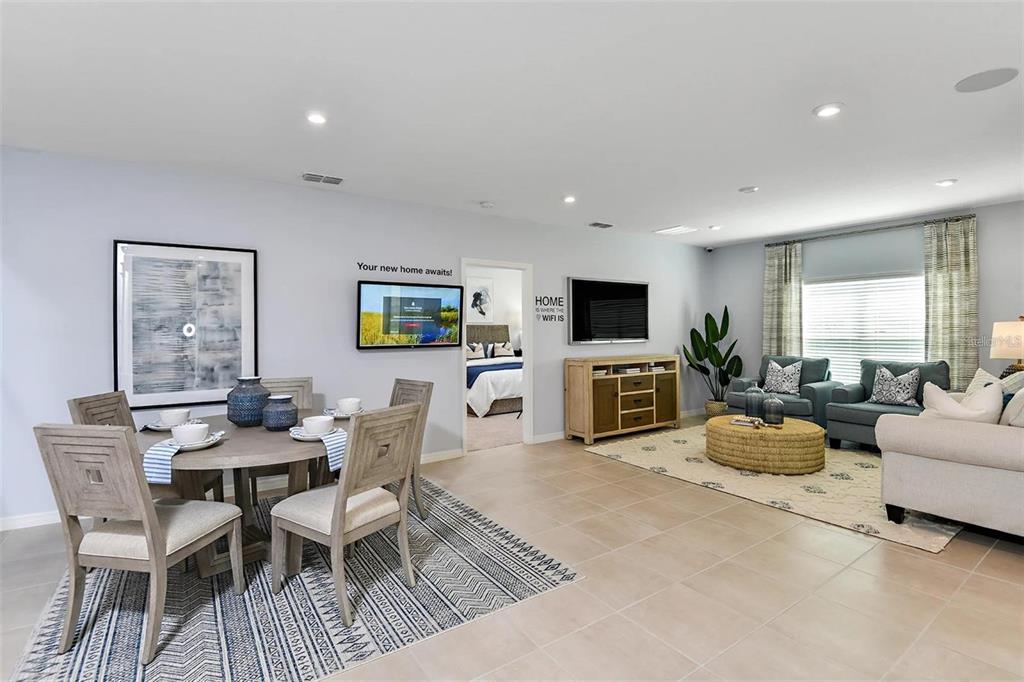 186 Jones Fish Camp Road Edgewater, FL 32141 - Photo 5 of 15 a living room with fireplace furniture and a flat screen tv