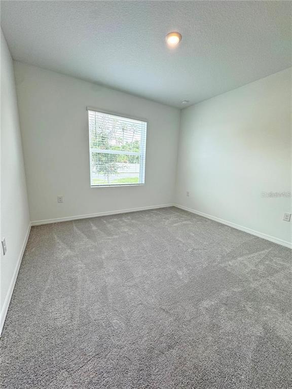 186 Jones Fish Camp Road Edgewater, FL 32141 - Photo 6 of 15 an empty room with windows