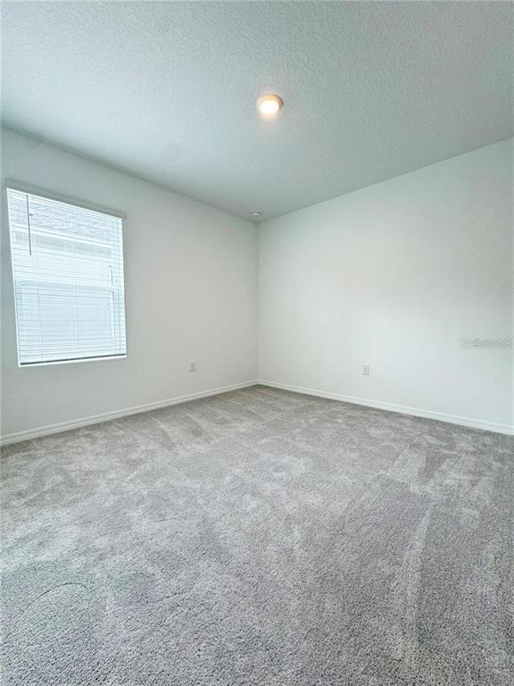 186 Jones Fish Camp Road Edgewater, FL 32141 - Photo 8 of 15 an empty room with a empty space and a window