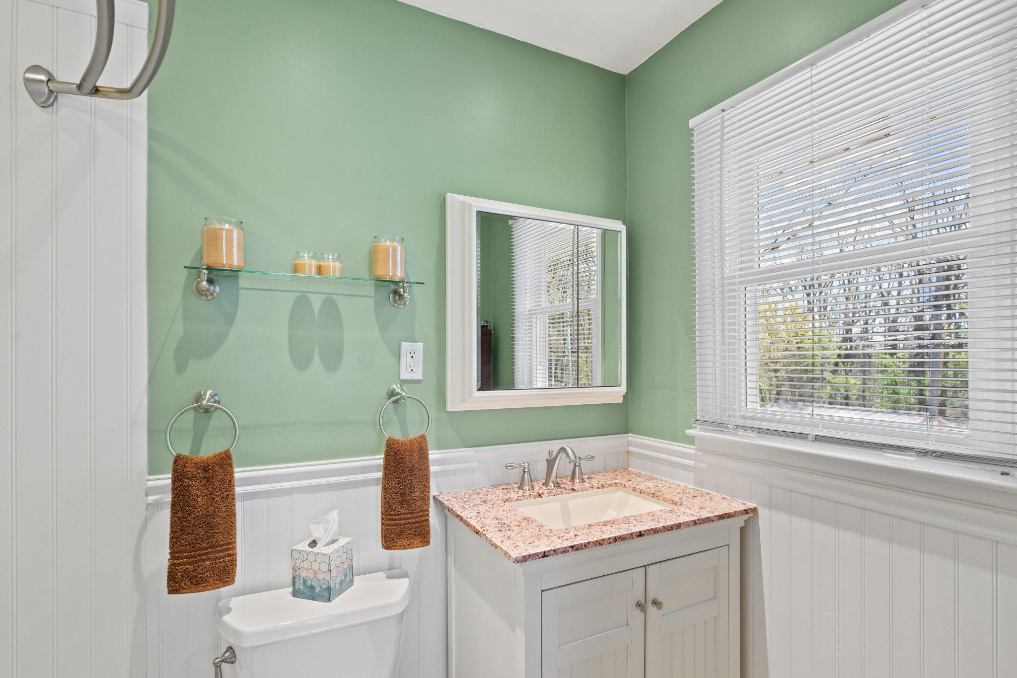 945 Homberg Avenue Baltimore, MD 21221 - Photo 18 of 27 a bathroom with a sink vanity granite toilet tub and next to a window