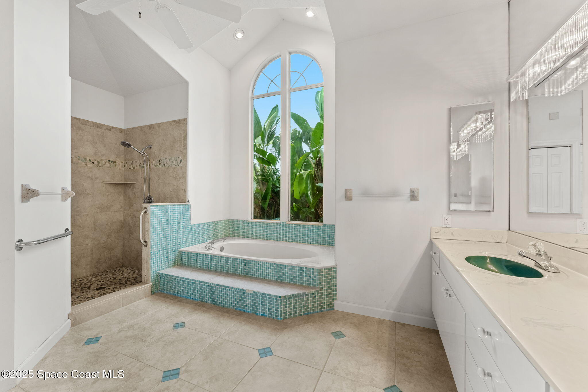 248 Loggerhead Drive Melbourne Beach, FL 32951 - Photo 16 of 35 a spacious bathroom with a granite countertop tub sink and mirror