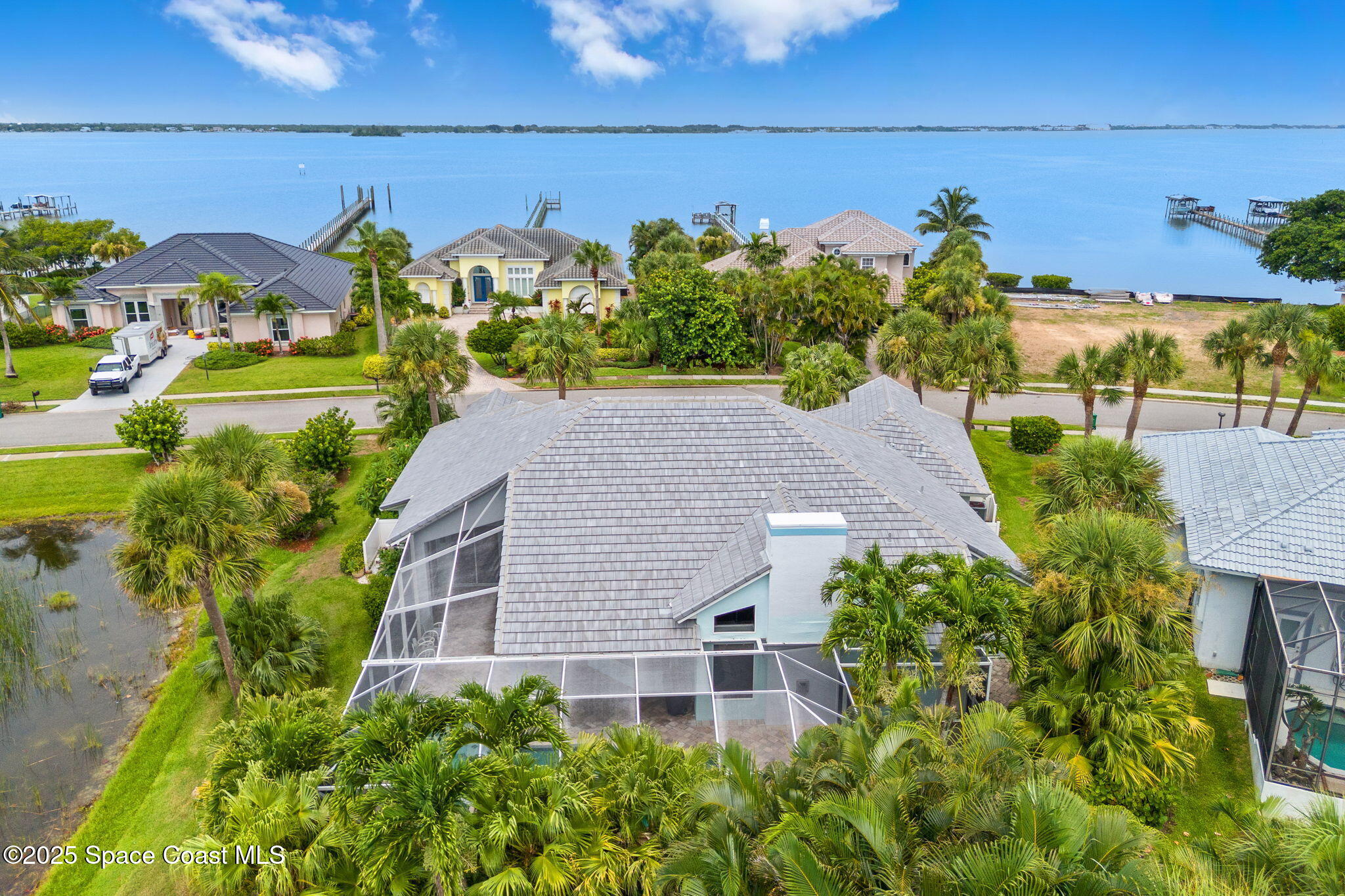 248 Loggerhead Drive Melbourne Beach, FL 32951 - Photo 27 of 35 a aerial view of a house with a yard and potted plants