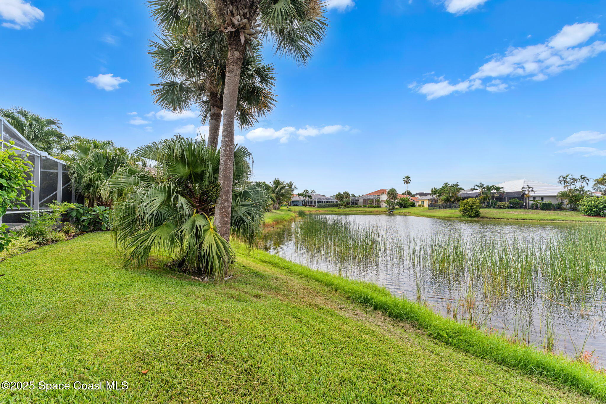 248 Loggerhead Drive Melbourne Beach, FL 32951 - Photo 29 of 35 a view of a lake with a big yard