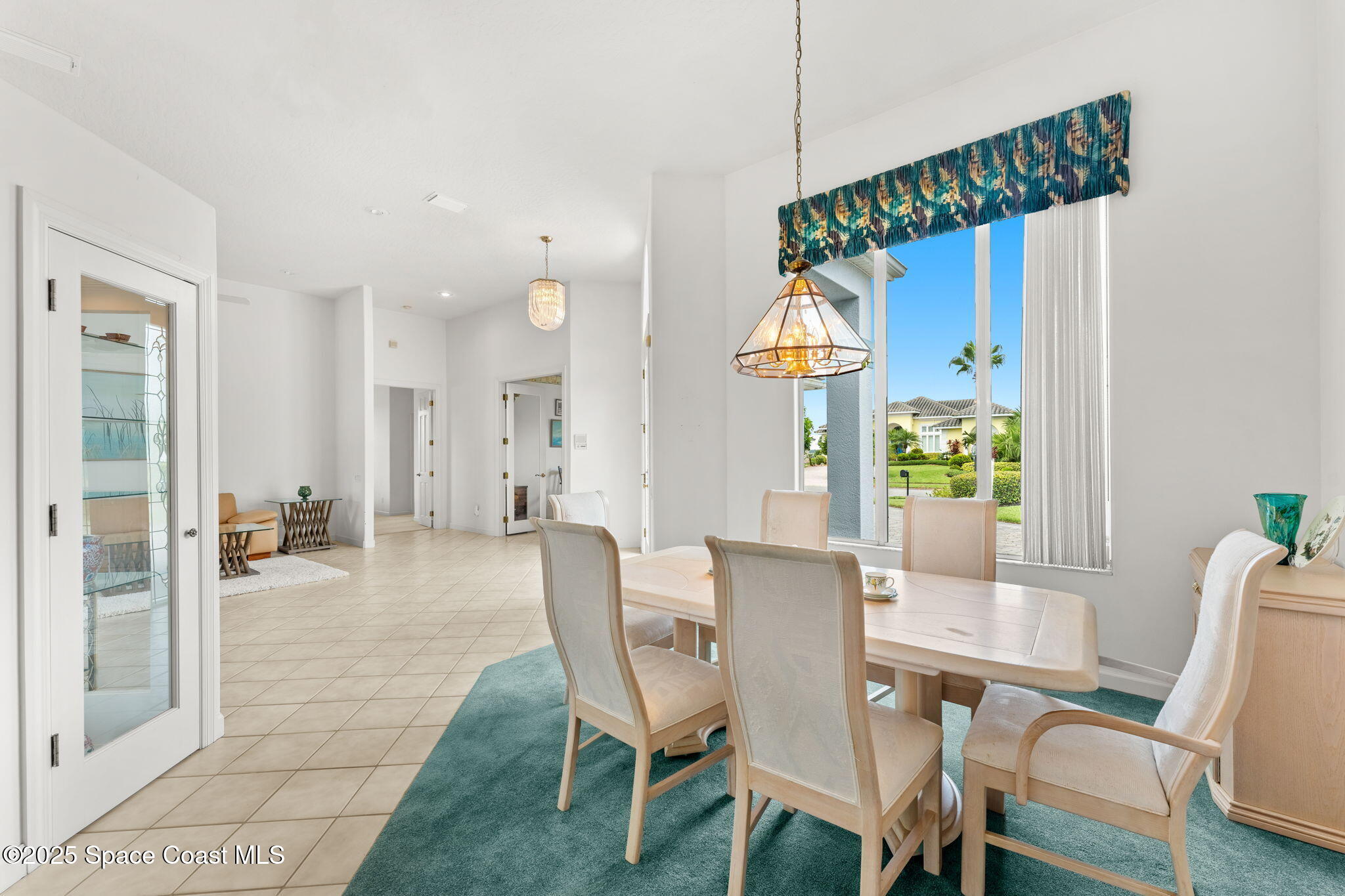 248 Loggerhead Drive Melbourne Beach, FL 32951 - Photo 5 of 35 a view of a dining room with furniture window and wooden floor