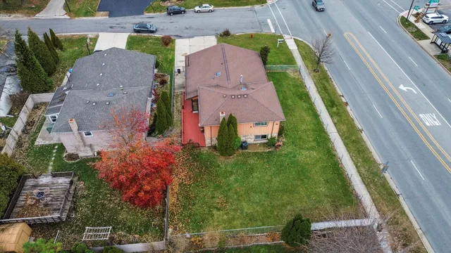 an aerial view of house with a yard