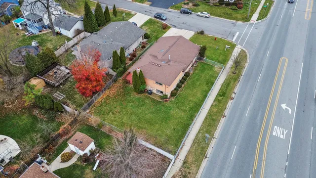 an aerial view of a house with a swimming pool