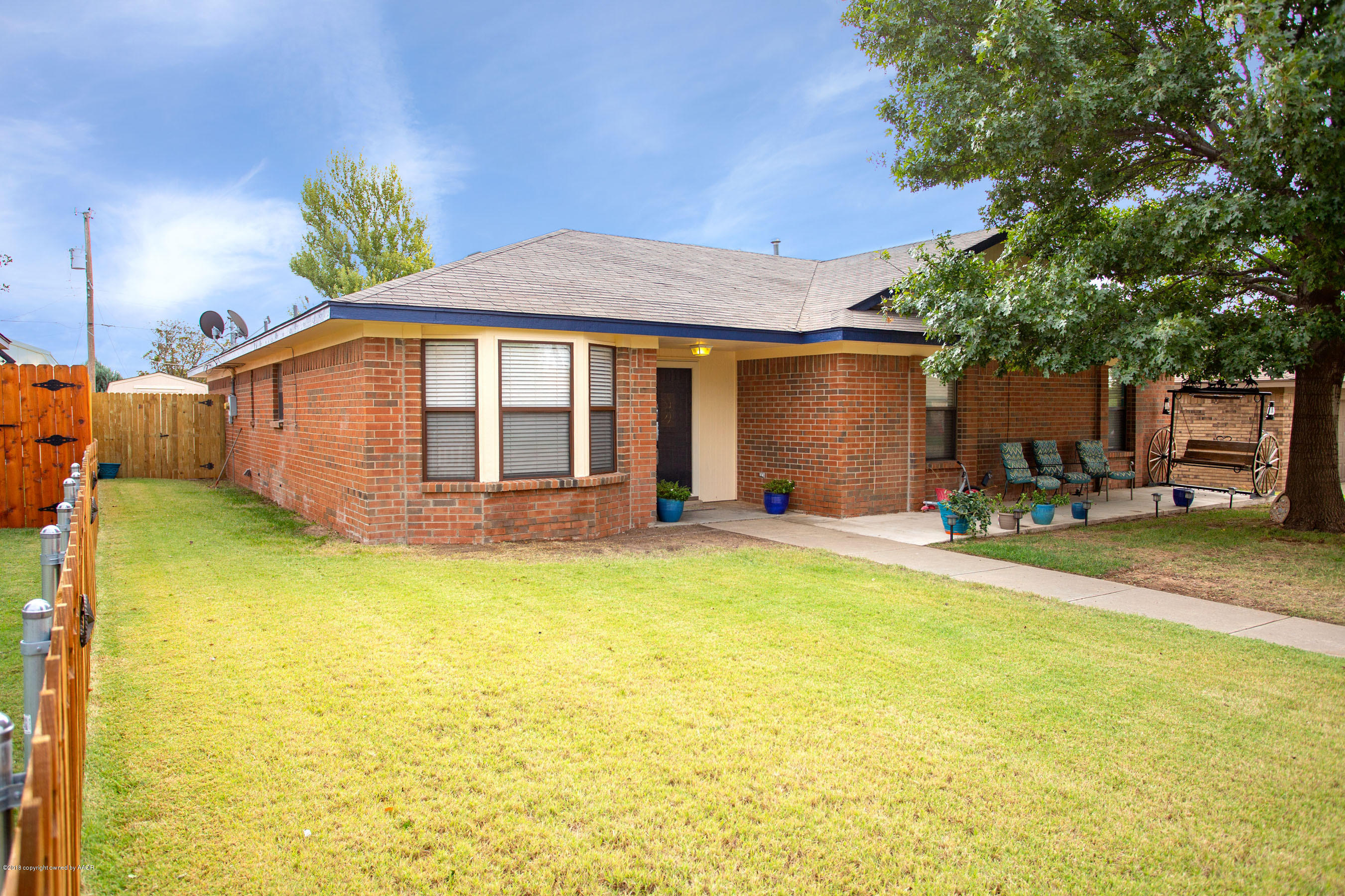 8209 Wrangler Trail Amarillo, TX 79110 - Photo 1 of 22 a front view of a house with a yard