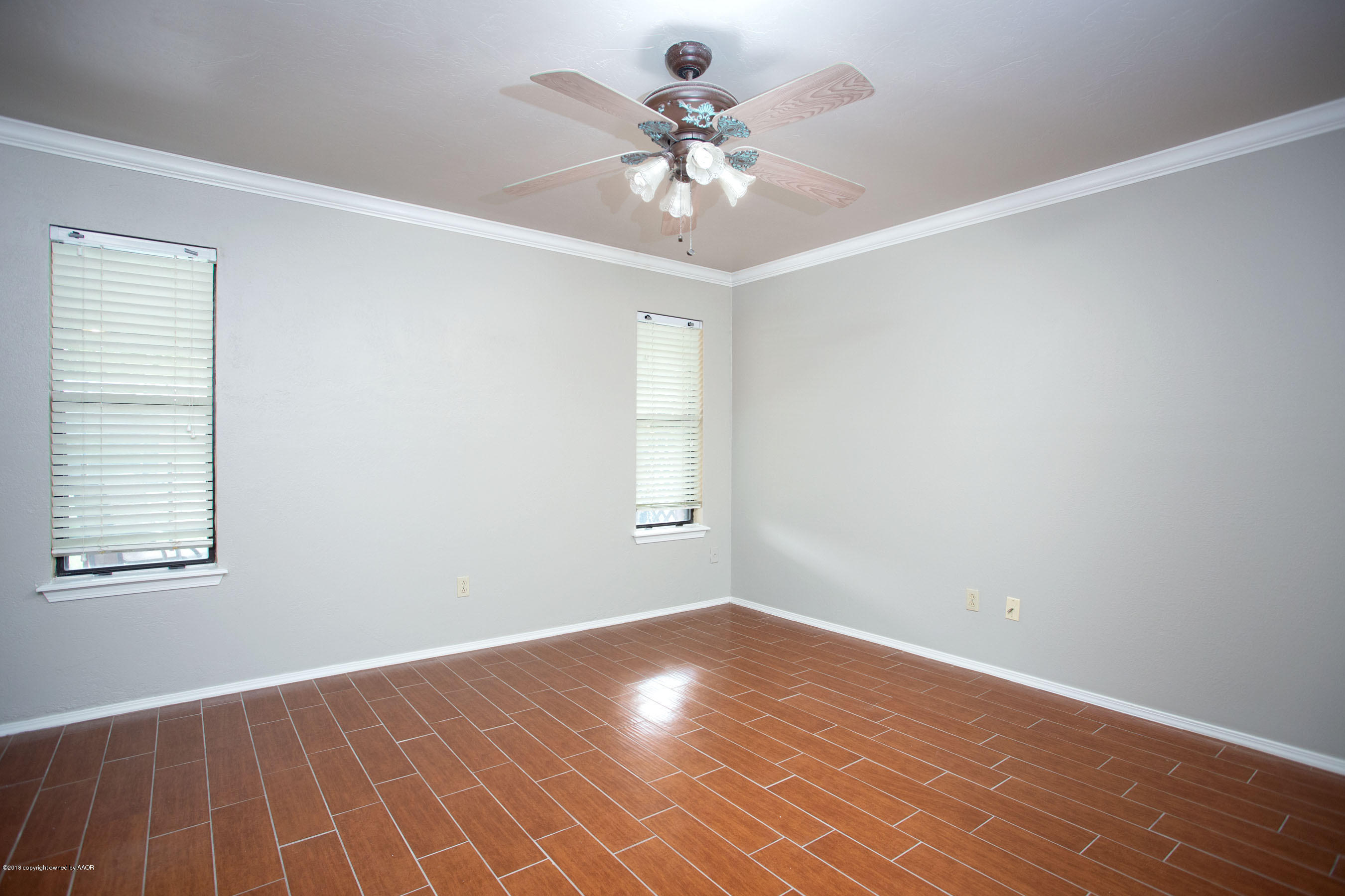 8209 Wrangler Trail Amarillo, TX 79110 - Photo 13 of 22 wooden floor in an empty room with a window