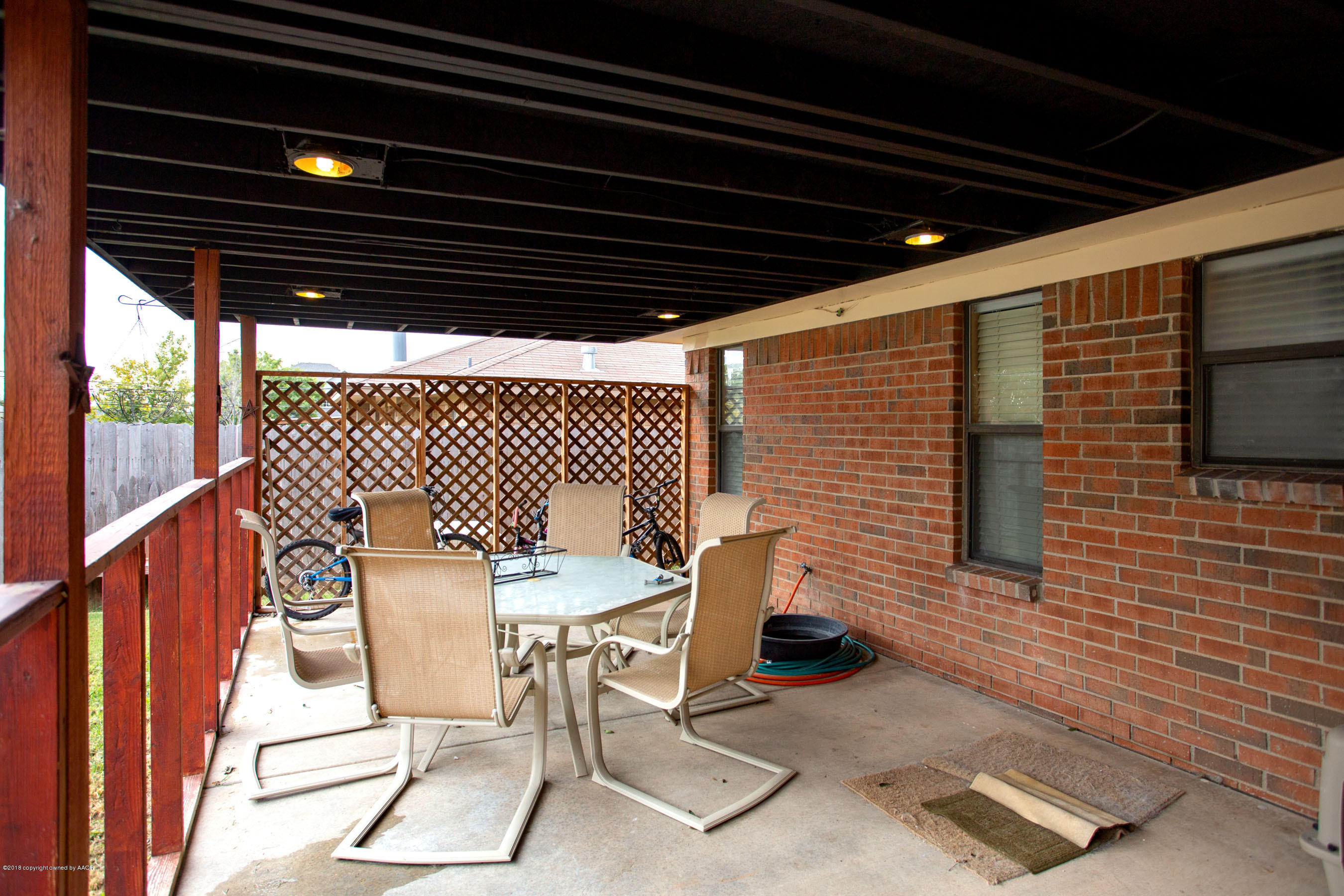 8209 Wrangler Trail Amarillo, TX 79110 - Photo 17 of 22 a patio with table and chairs