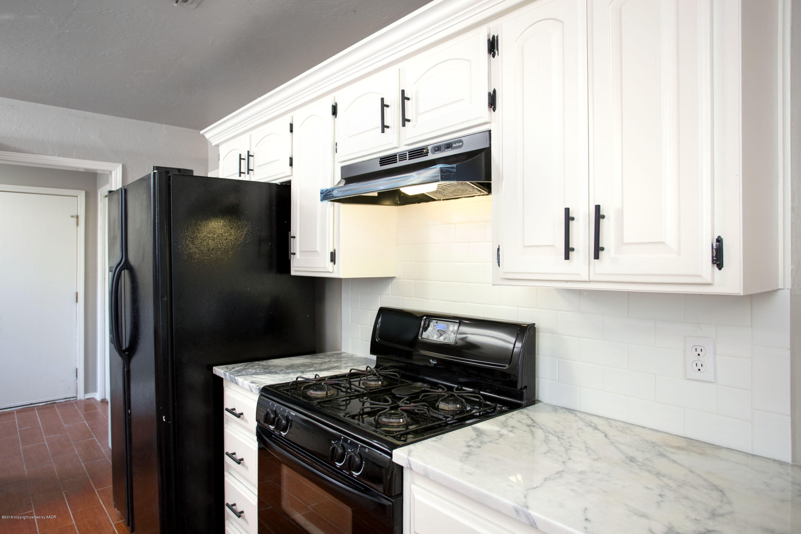 8209 Wrangler Trail Amarillo, TX 79110 - Photo 5 of 22 a kitchen with stainless steel appliances granite countertop a stove and a refrigerator