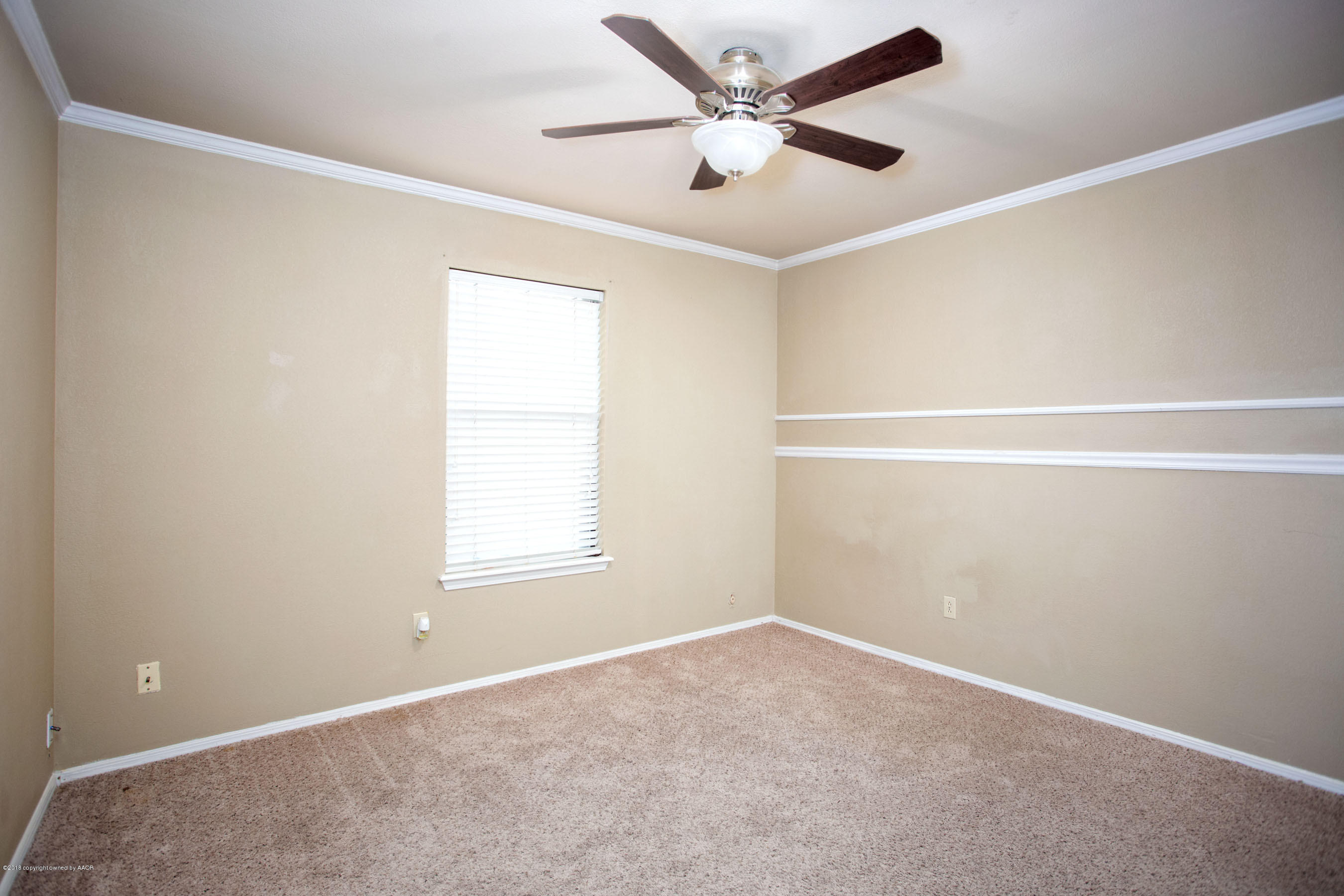 8209 Wrangler Trail Amarillo, TX 79110 - Photo 10 of 22 an empty room with a window and a fan