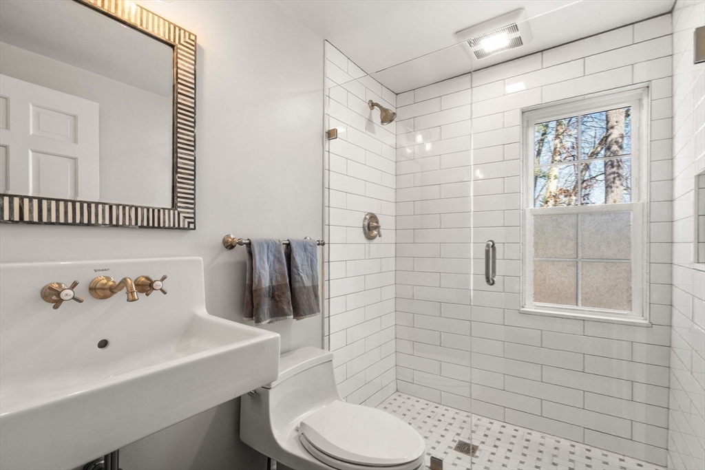 170 Benvenue Street Wellesley, MA 02482 - Photo 11 of 22 a bathroom with a sink toilet and shower