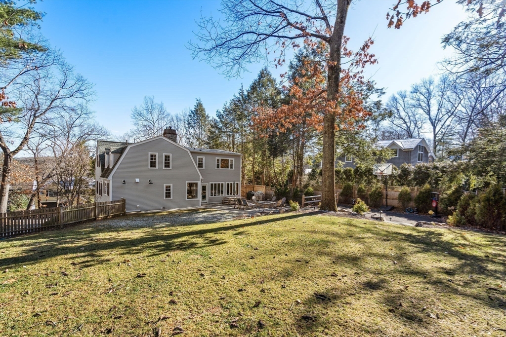 170 Benvenue Street Wellesley, MA 02482 - Photo 19 of 22 a view of a house with a yard covered with snow
