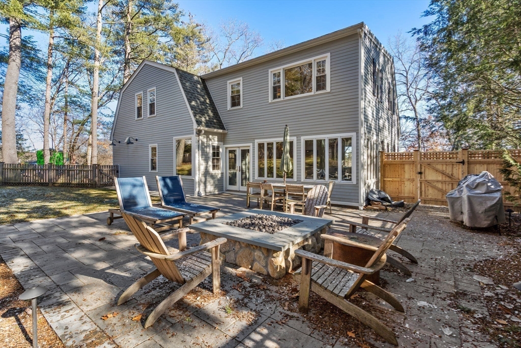 170 Benvenue Street Wellesley, MA 02482 - Photo 20 of 22 a view of a dinning table and chairs in backyard of the house