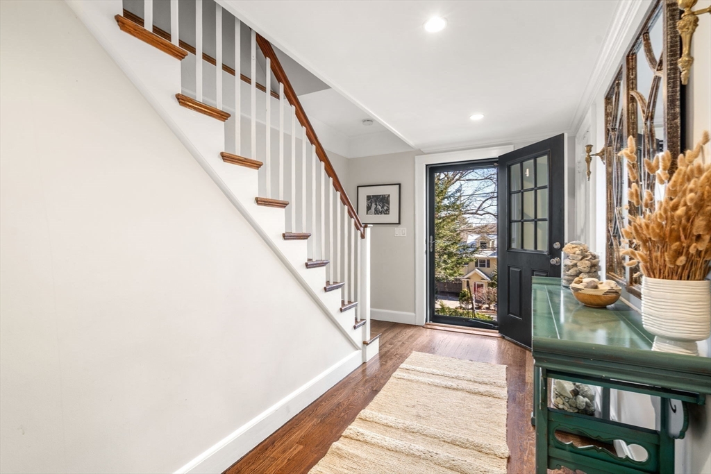 170 Benvenue Street Wellesley, MA 02482 - Photo 2 of 22 a view of staircase with lots of stuff and couches