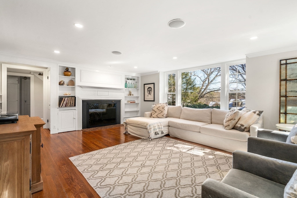 170 Benvenue Street Wellesley, MA 02482 - Photo 7 of 22 a living room with furniture large window and a fireplace