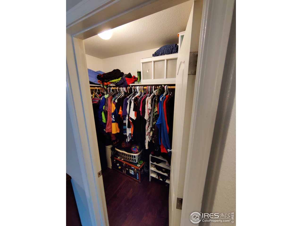10567 Titan Avenue Firestone, CO 80504 - Photo 12 of 17 a view of a hallway with wooden floor