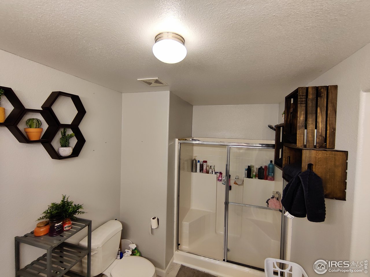 10567 Titan Avenue Firestone, CO 80504 - Photo 15 of 17 a bathroom with a shower