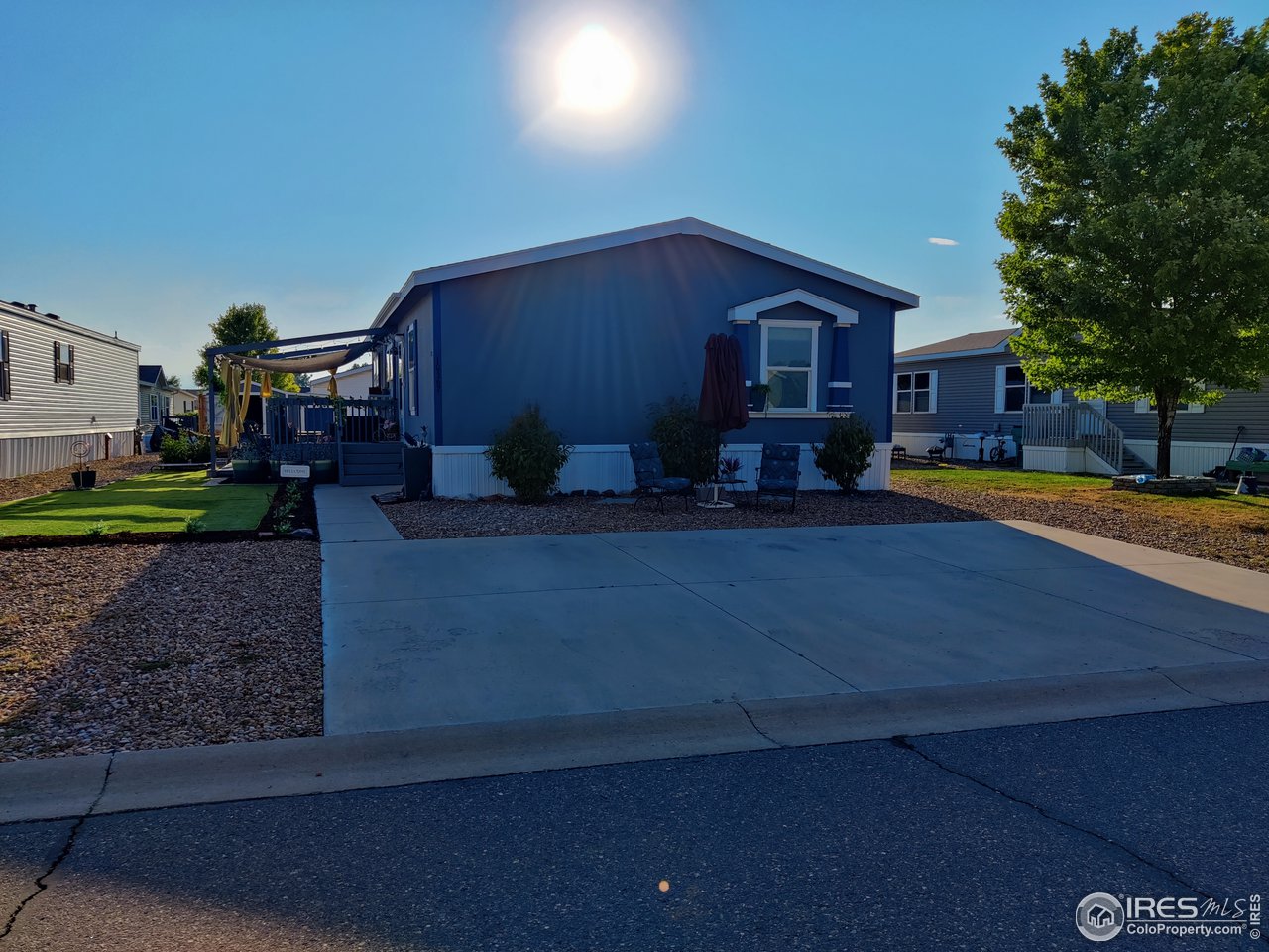 10567 Titan Avenue Firestone, CO 80504 - Photo 2 of 17 a wooden bench sitting in front of a house
