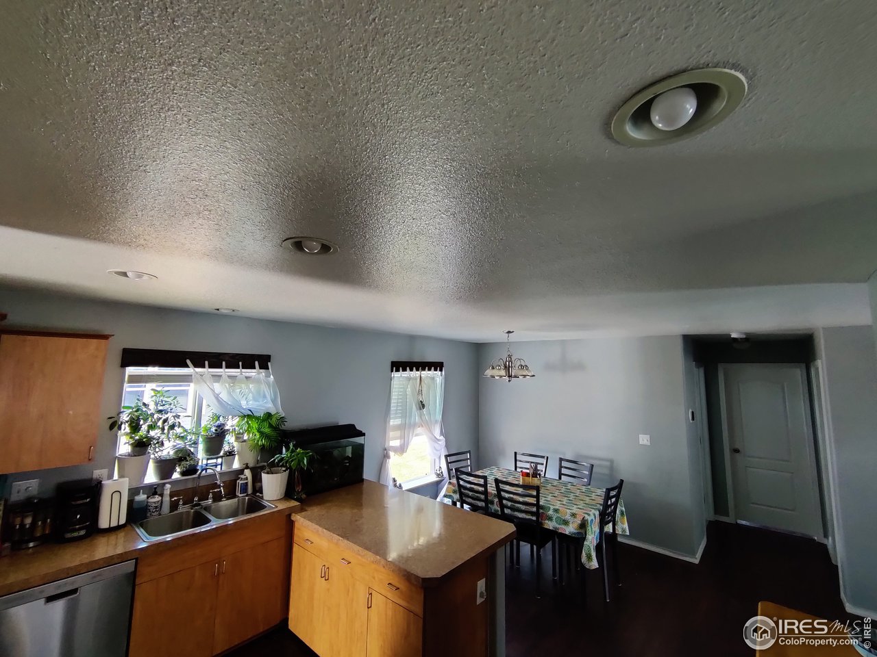 10567 Titan Avenue Firestone, CO 80504 - Photo 4 of 17 a kitchen with a table chairs and a stove