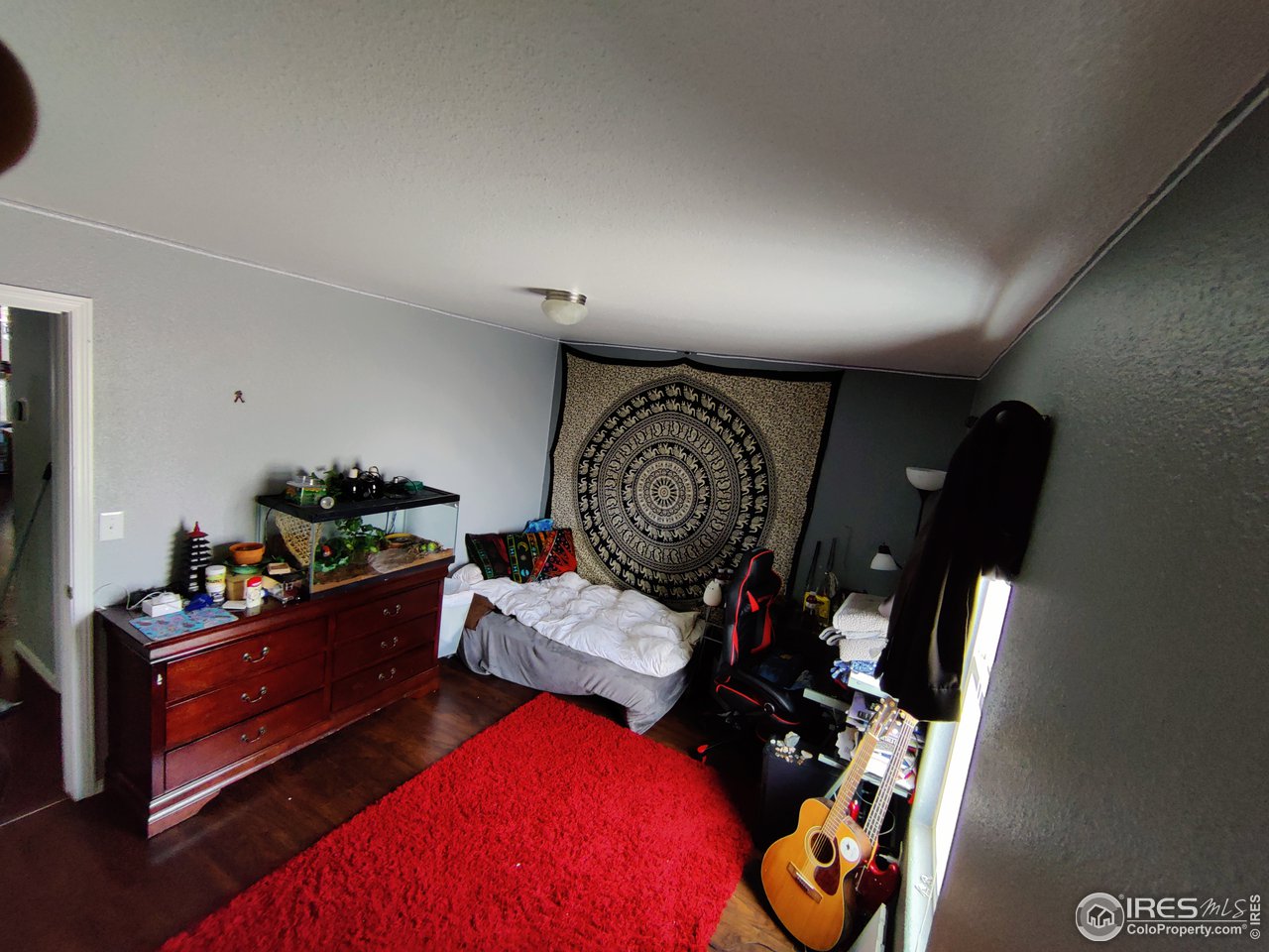 10567 Titan Avenue Firestone, CO 80504 - Photo 8 of 17 a bedroom with furniture and workout equipment