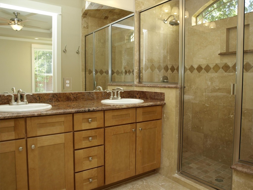 4514 Depew Avenue, Unit A Austin, TX 78751 - Photo 7 of 7 a bathroom with a shower sink and mirror