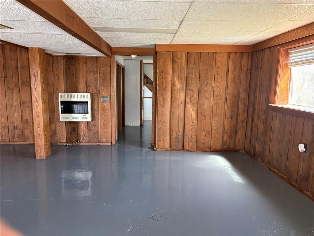 112 Matthew Lane Carmichaels, PA 15320 - Photo 15 of 21 an empty room with wooden floor fireplace and windows