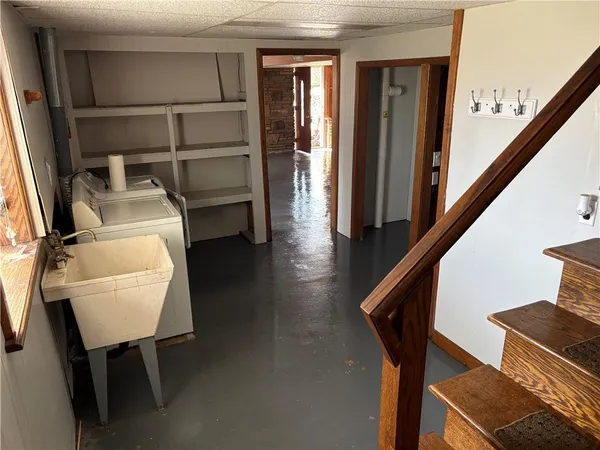 a view of walk in closet with wooden floor