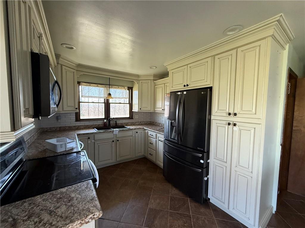 112 Matthew Lane Carmichaels, PA 15320 - Photo 4 of 21 a kitchen with a refrigerator and a sink