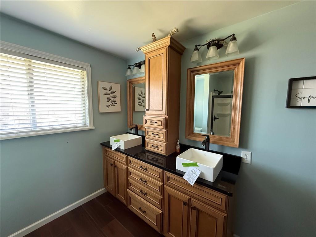 112 Matthew Lane Carmichaels, PA 15320 - Photo 9 of 21 a bathroom with granite countertop a sink and a window