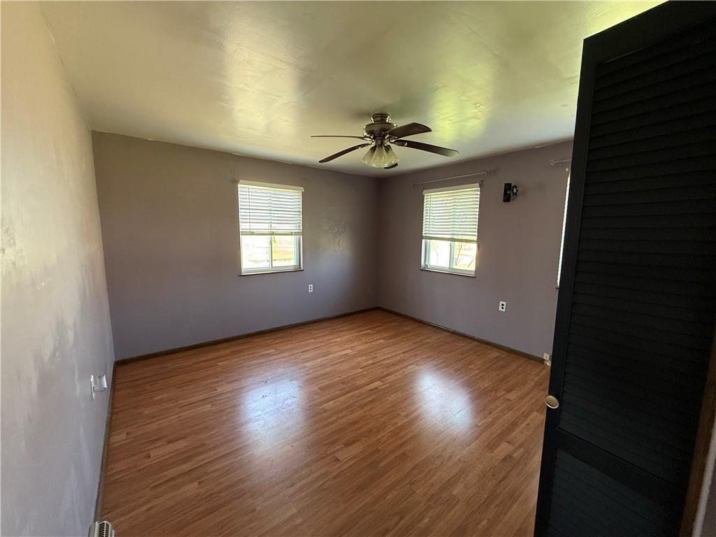 112 Matthew Lane Carmichaels, PA 15320 - Photo 10 of 21 an empty room with wooden floor and windows