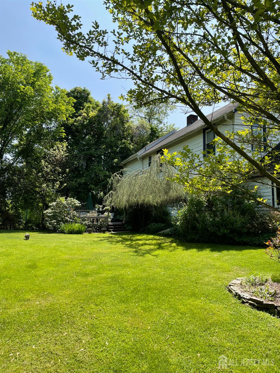 181 Disbrow Hill Road Monroe Township, NJ 08831 - Photo 18 of 21 a view of yard with swimming pool and green space