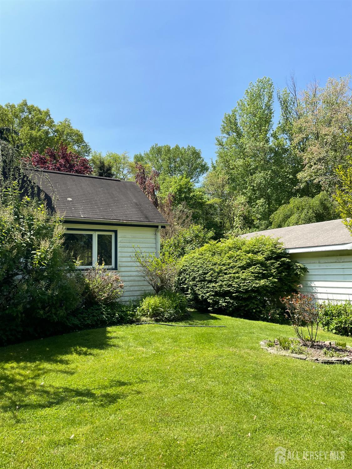 181 Disbrow Hill Road Monroe Township, NJ 08831 - Photo 19 of 21 a view of a house with garden